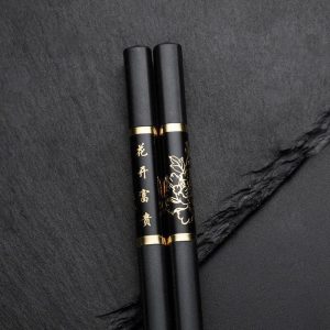 Baguettes Chinoises Noires et Dorées